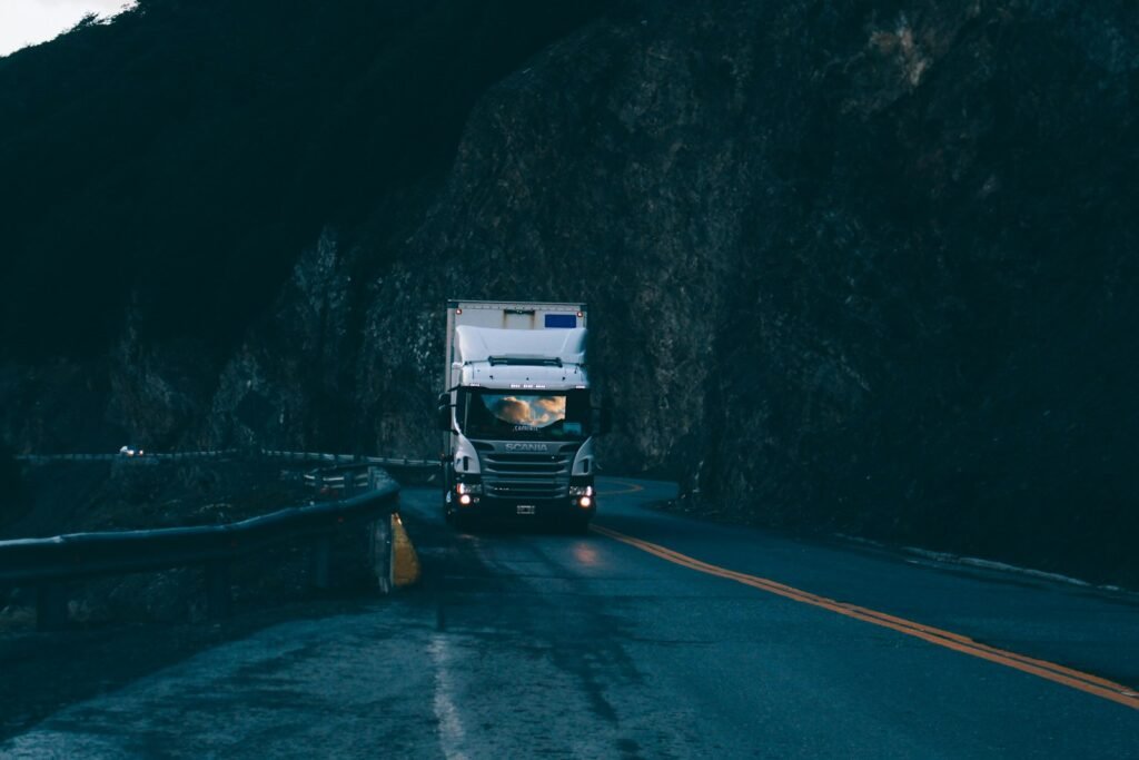 Semi truck with trailer traveling on a highway