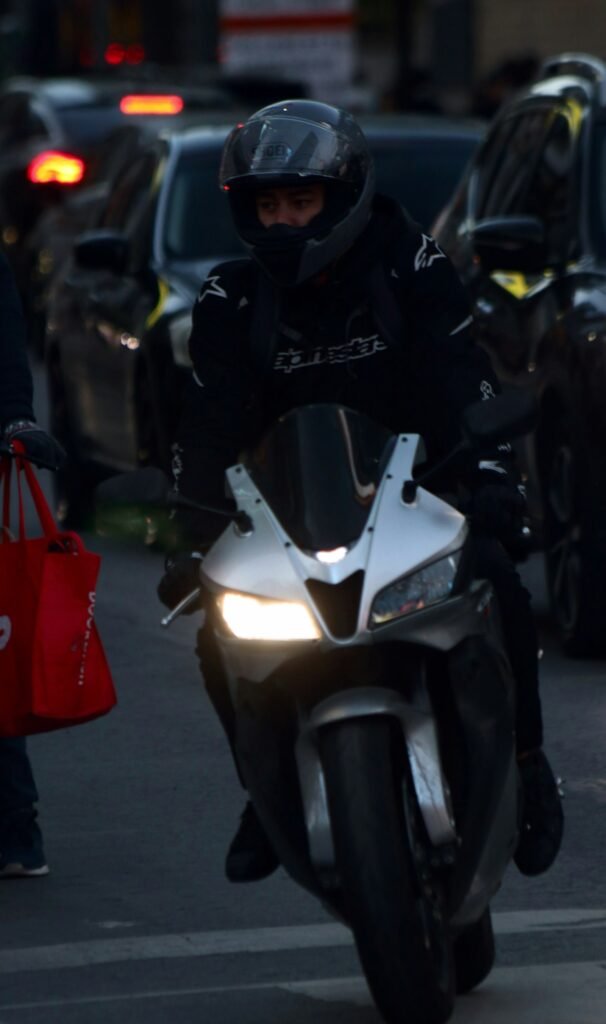 Person riding a motorcycle in traffic