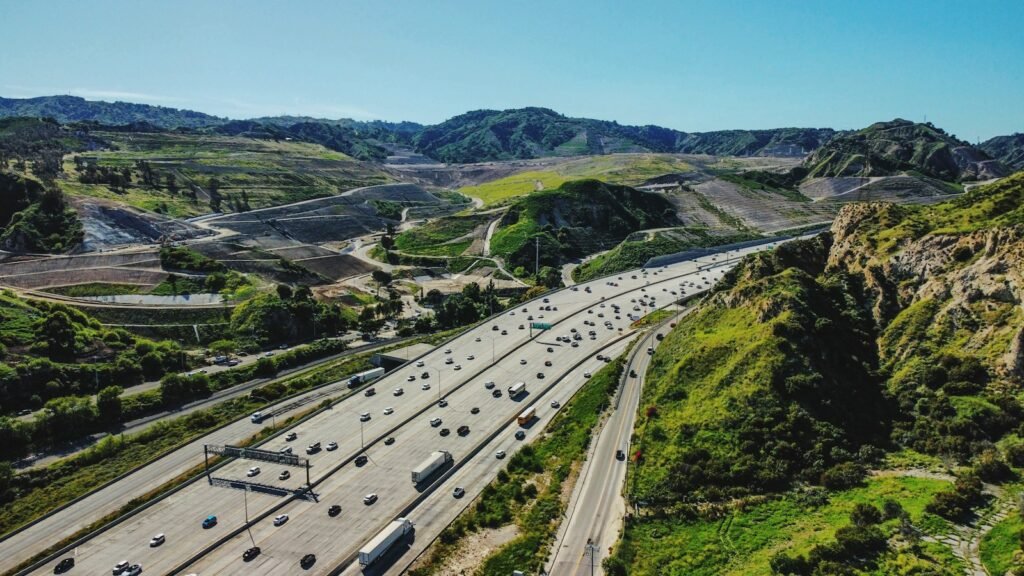 Aerial view of a highway winding through the mountains